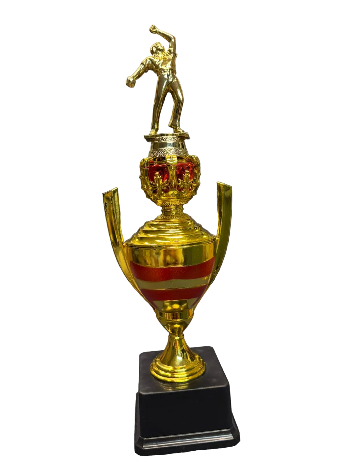 Gold trophy with a figure on top, placed on a chair in an indoor setting.