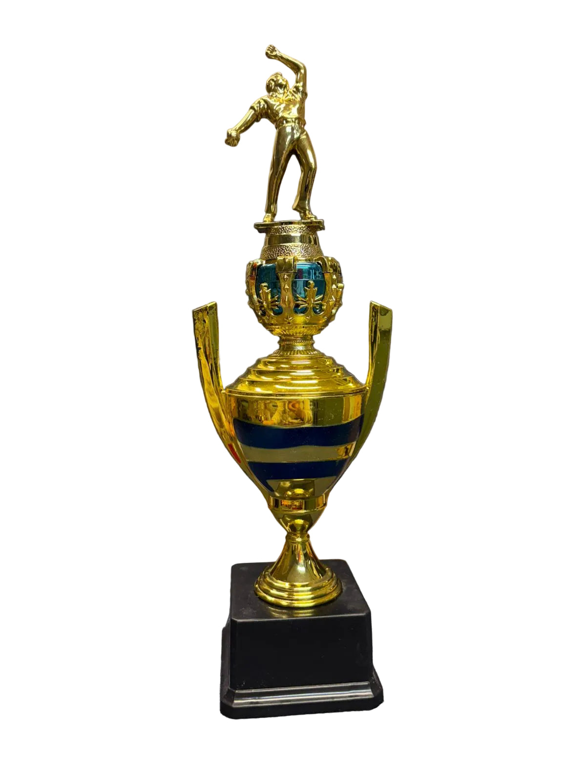 Gold trophy with a black base on a chair in an indoor setting