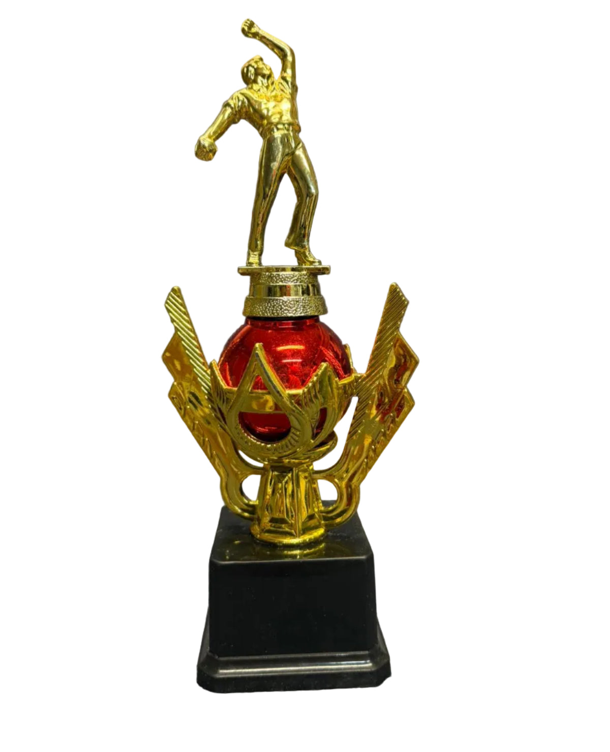 Decorative trophy with a gold figure on top of a red ball, sitting on a chair.