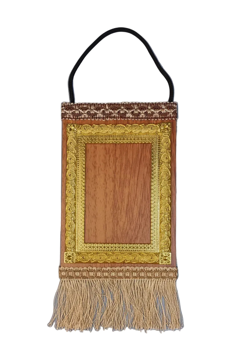 Decorative wall hanging with wooden center and gold frame on a plain background
